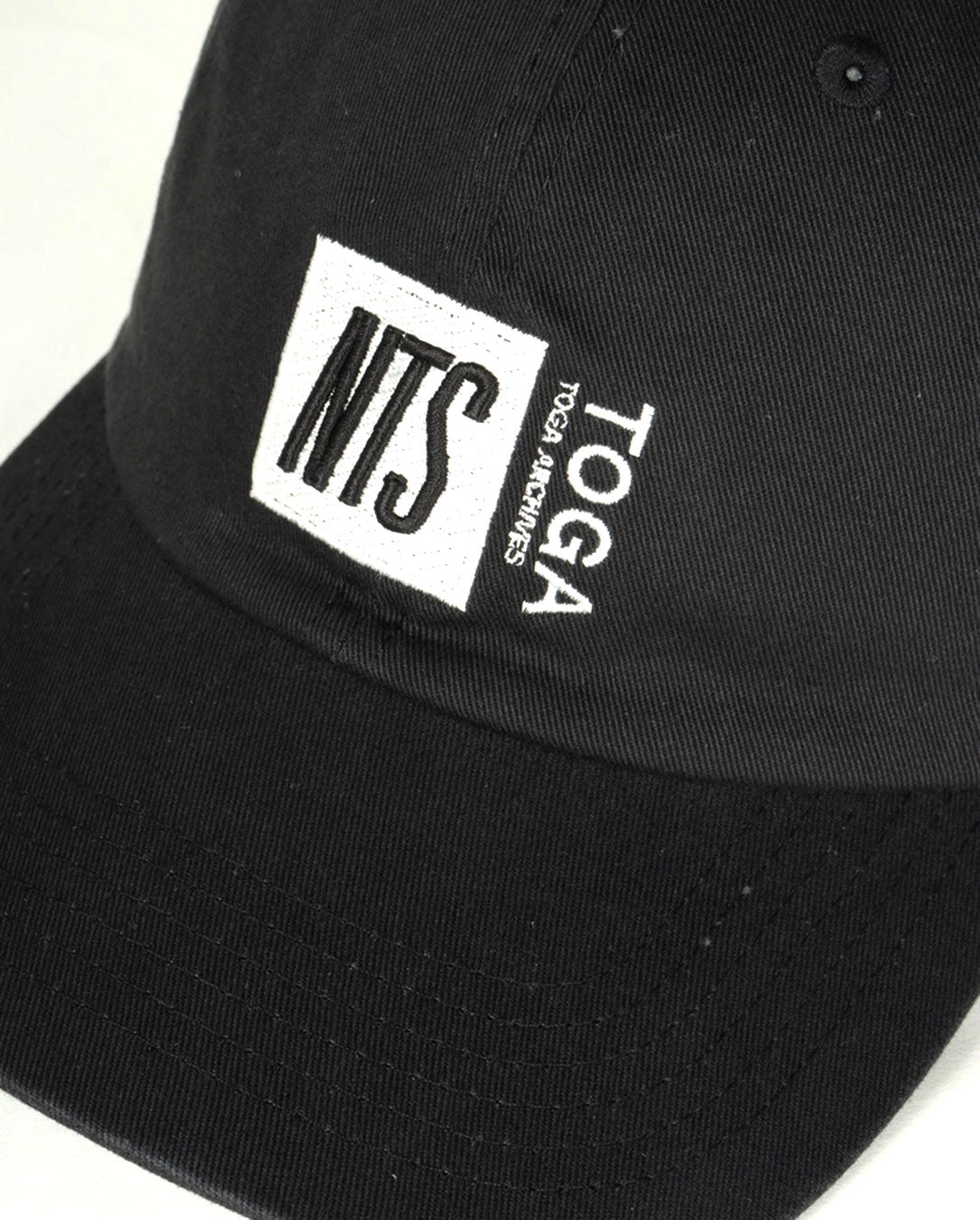 Logo Cap TOGA×NTS
